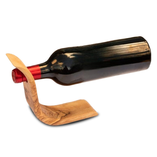 Freestanding olive wood wine bottle holder balancing a full wine bottle in mid-air