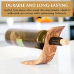 Olive wood balancing wine bottle holder styled as a housewarming or wedding gift